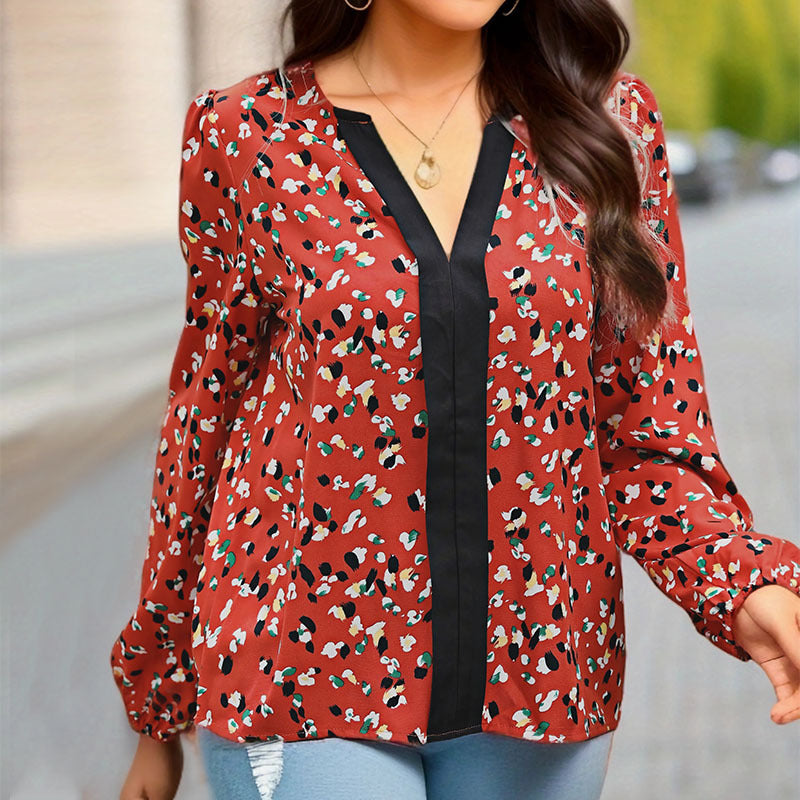 Damen Locker geschnittene V-Ausschnitt-Bluse mit kontrastierter Zierblende und Allover-Print Shop Nory
