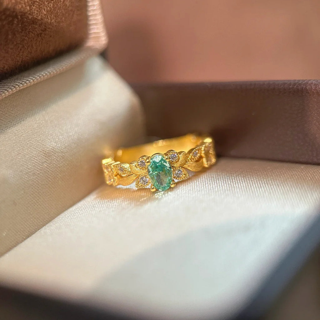 Damen eleganter Ring mit ovalem Edelstein und kunstvollen Zirkonia-Details Shop Nory