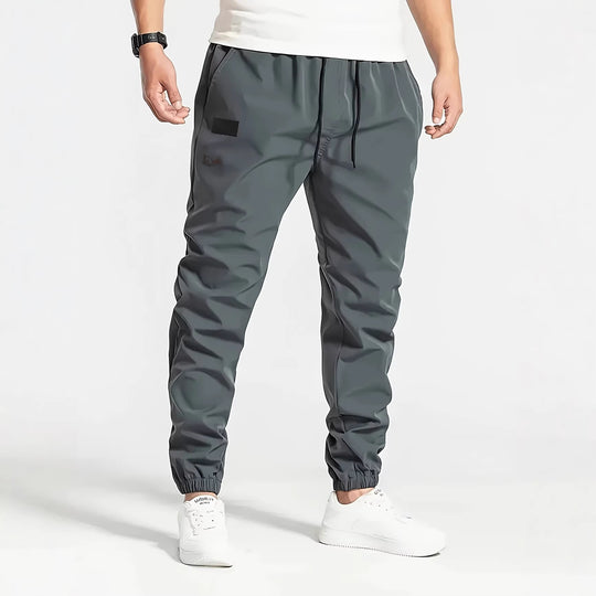 Herren Technische Jogginghose im Tapered‑Utility‑Stil mit elastischem Bund & Knöchelbündchen Shop Nory