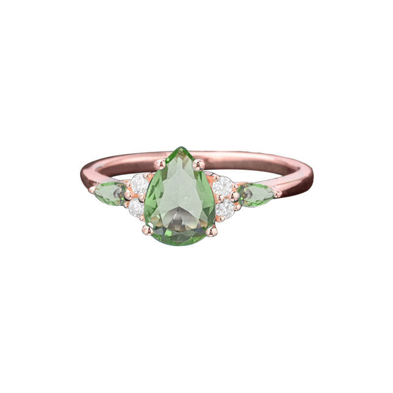 Damen filigraner Ring mit tropfenförmigem grünen Edelstein und funkelnden Zirkoniasteinen Shop Nory