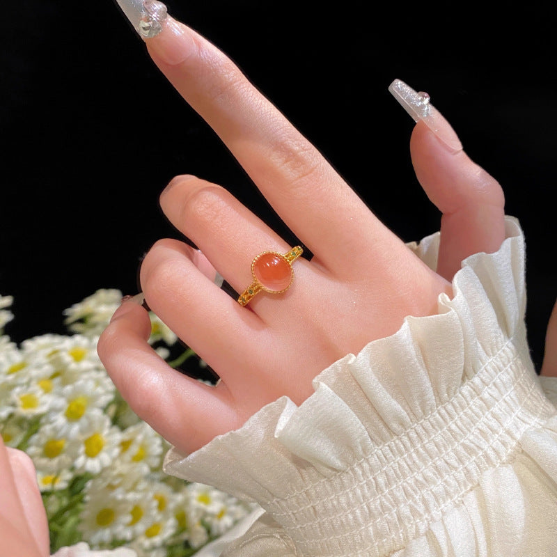 Damenring mit ovalem Rosenquarz und filigranem Golddesign Shop Nory