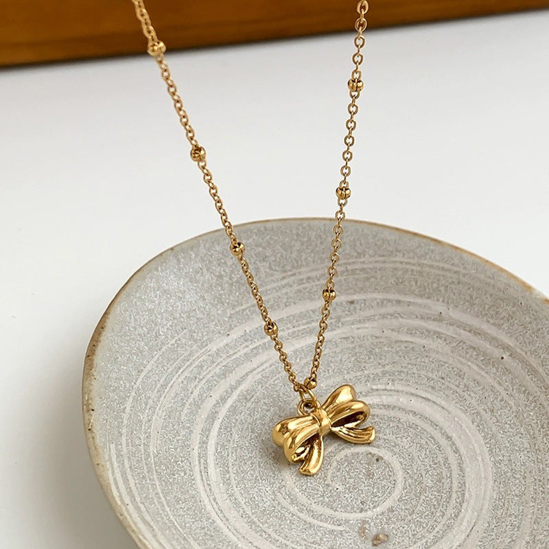 Damen Halskette mit elegantem Schleifenanhänger aus hochwertigem Edelstahl Shop Nory