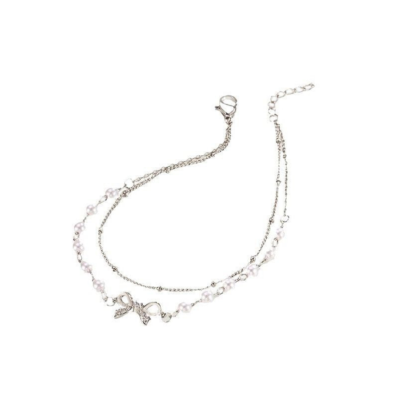 Damen Armband mit zartem Perlendetail und charmantem Anhänger Shop Nory