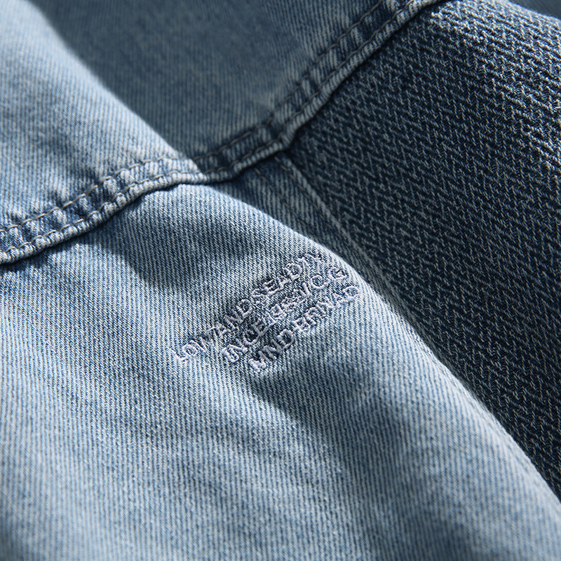 Unisex Oversize-Jeansjacke mit kontrastreichen Webpaneelen und Druckknopfverschluss Shop Nory