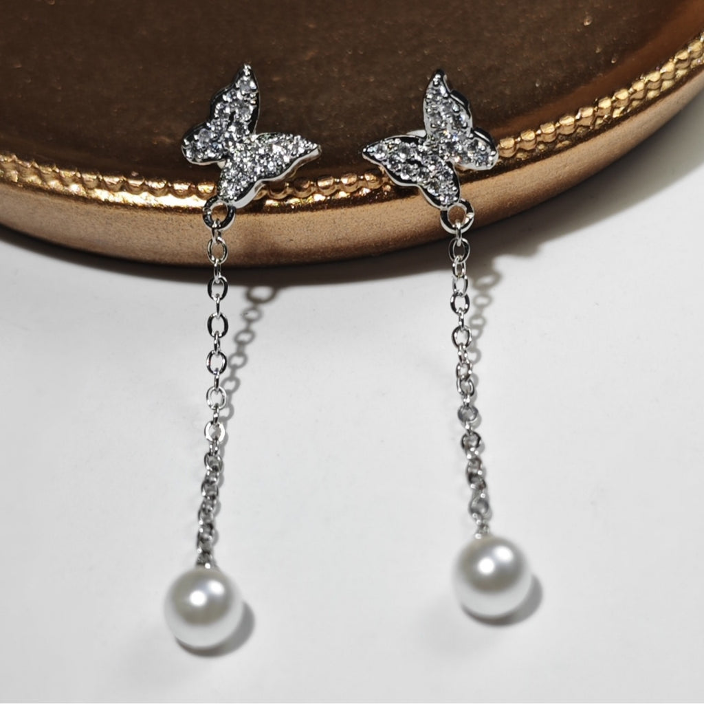 Damen Ohrringe mit Schmetterlingsdesign und Perlenanhängern Shop Nory