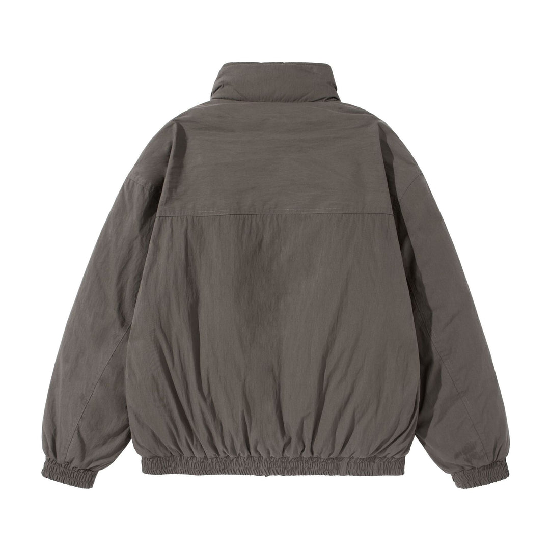 Unisex Kurz geschnittene gesteppte Boxy‑Blousonjacke mit hohem Stehkragen und Utility‑Flaptaschen Shop Nory