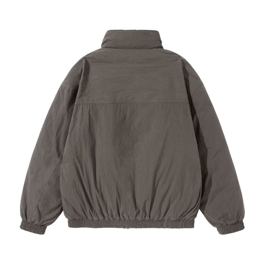 Unisex Kurz geschnittene gesteppte Boxy‑Blousonjacke mit hohem Stehkragen und Utility‑Flaptaschen Shop Nory