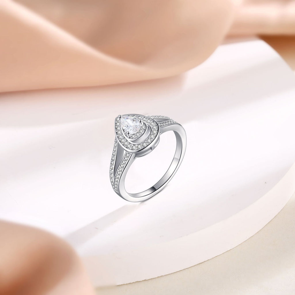 Damen eleganter Tropfenring mit funkelndem Hauptstein und kunstvollen Zirkonia-Verzierungen Shop Nory