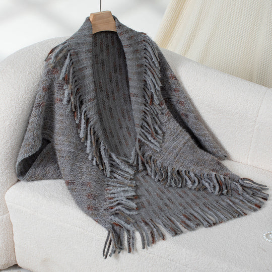 Damen eleganter Poncho mit fransigen Details und modernem Karomuster