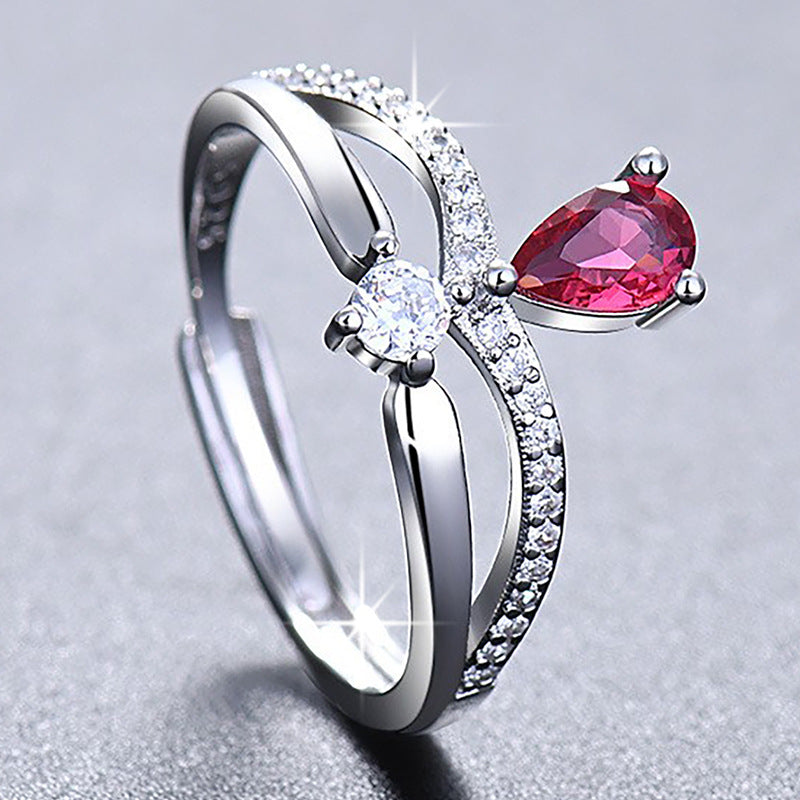 Damenring mit elegantem, tropfenförmigem Edelsteinbesatz und Zirkonia-Details Shop Nory