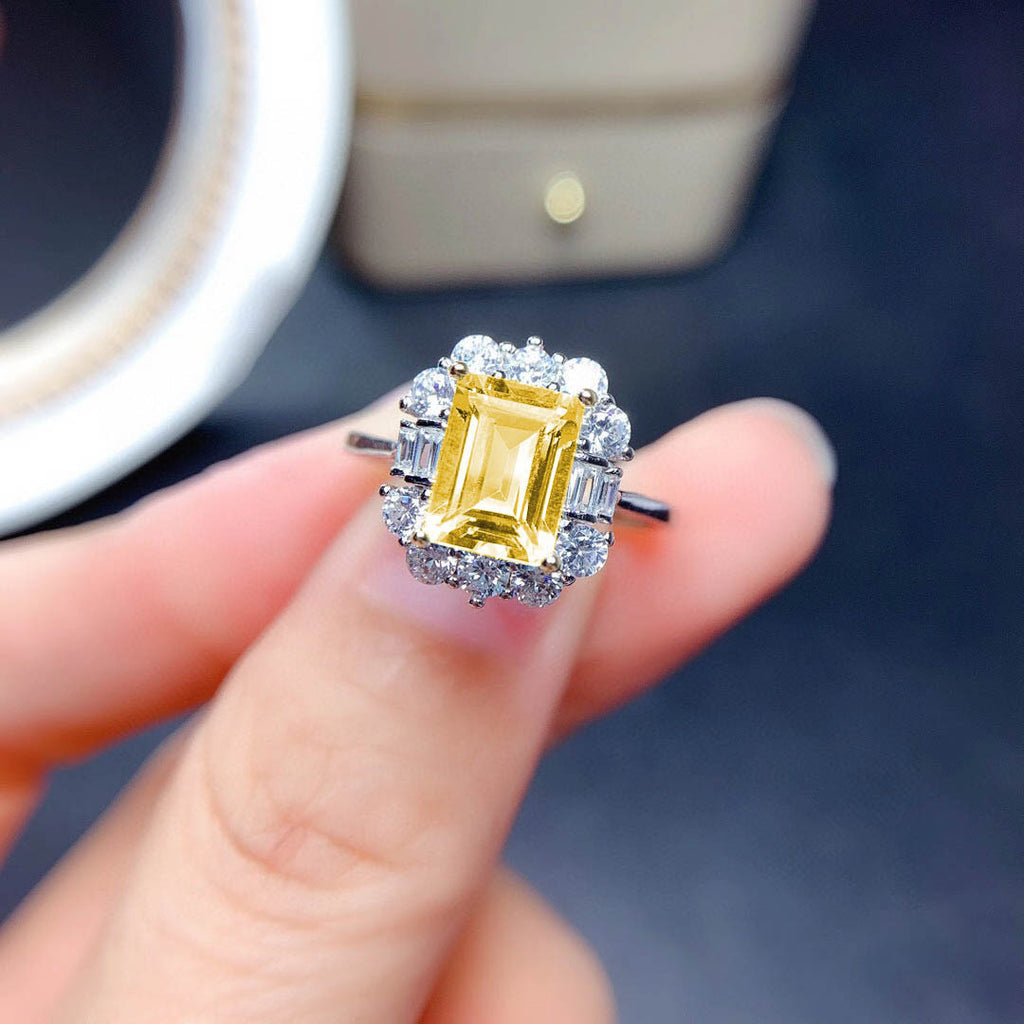 Damenring mit luxuriösem rechteckigen Edelstein und funkelnden Zirkonia Steinen Shop Nory