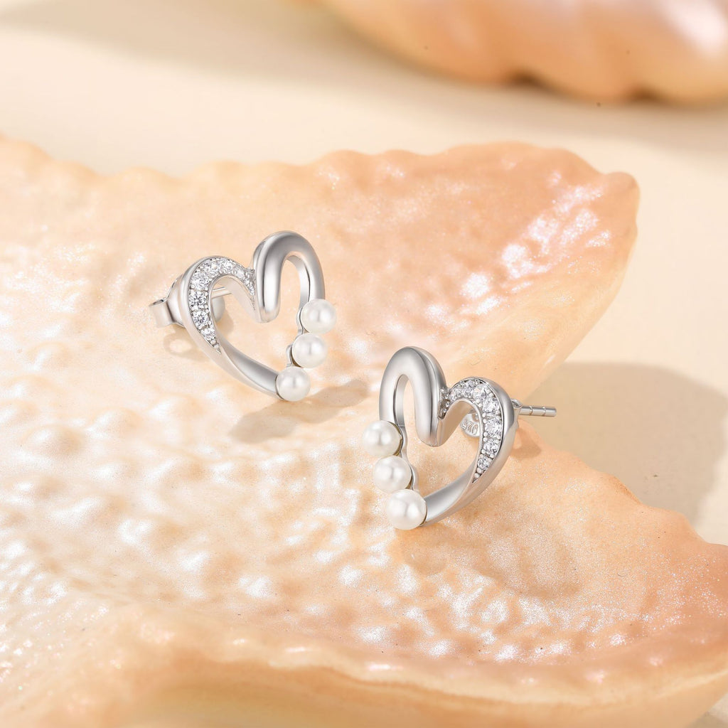 Damen Ohrstecker mit modernem, geschwungenem Design und funkelnden Kristallen Shop Nory