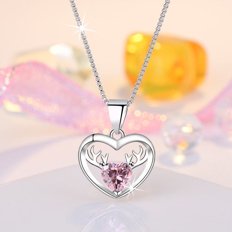 Damen Halskette mit herzförmigem Anhänger und eleganten Hirschakzenten Shop Nory