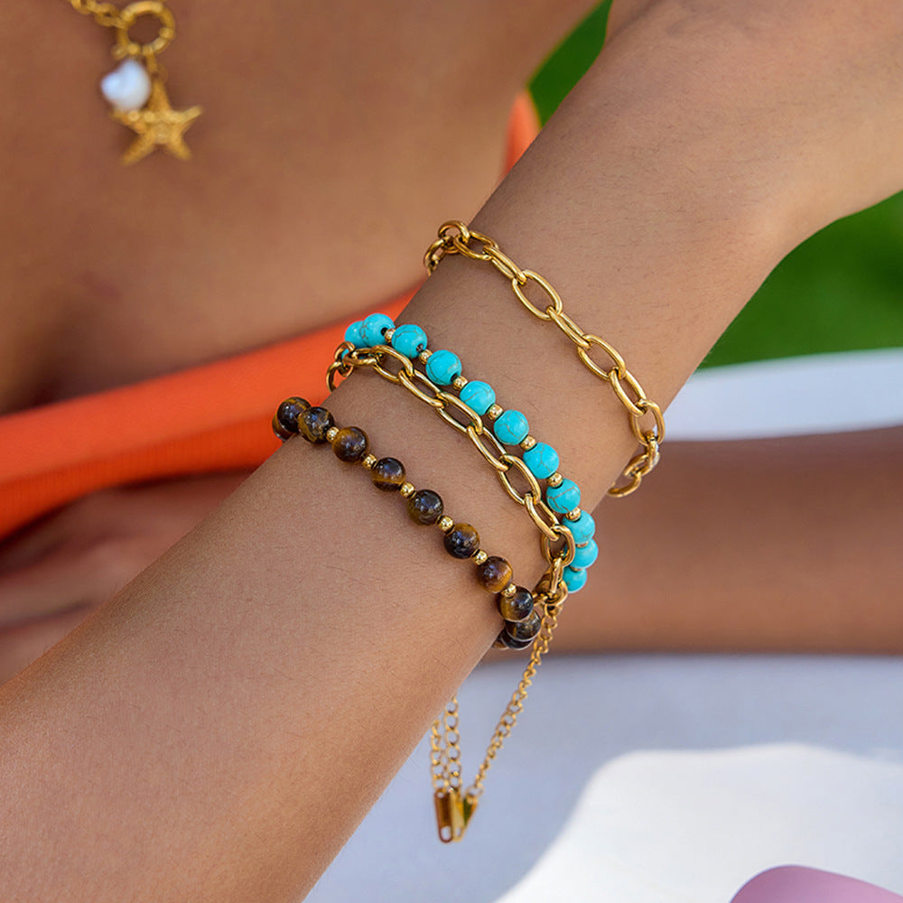Damen Armband mit goldfarbener Edelstahlkette und charmanten Steinakzenten Shop Nory