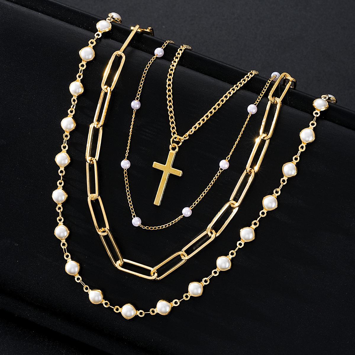 Damen mehrlagige Halskette mit elegantem Kreuzanhänger und Perlendetails Shop Nory