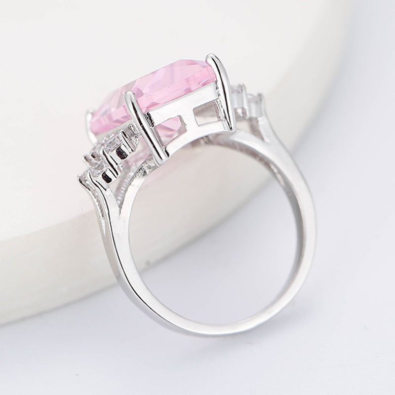 Damen luxuriöser Schmuckring mit rechteckigem pinkem Stein und funkelnden Zirkonia Shop Nory