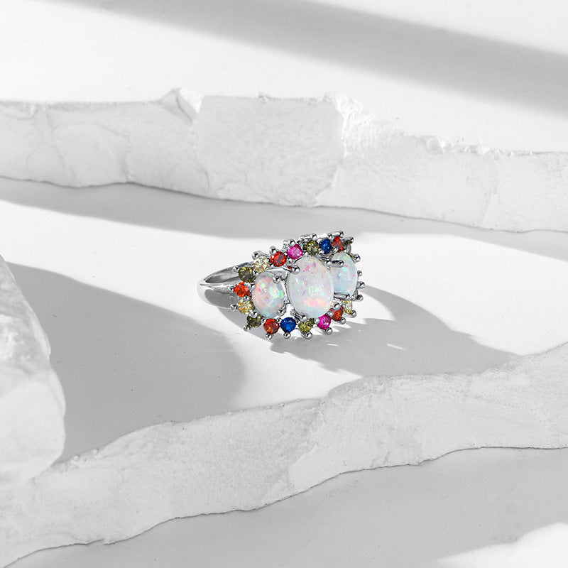 Damen eleganter Ring mit opalisierten Steinen und bunten Akzenten Shop Nory