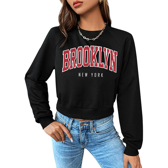 Damen Cropped College-Sweatshirt mit Rundhalsausschnitt, Raglanärmeln und Brooklyn-Print Shop Nory