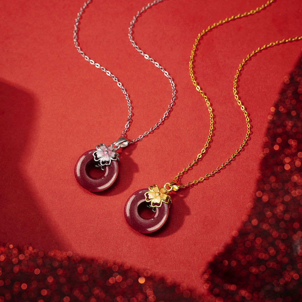 Damen Halskette aus edlem Gold mit blütenförmigem Anhänger und goldener Eye-Catcher Shop Nory