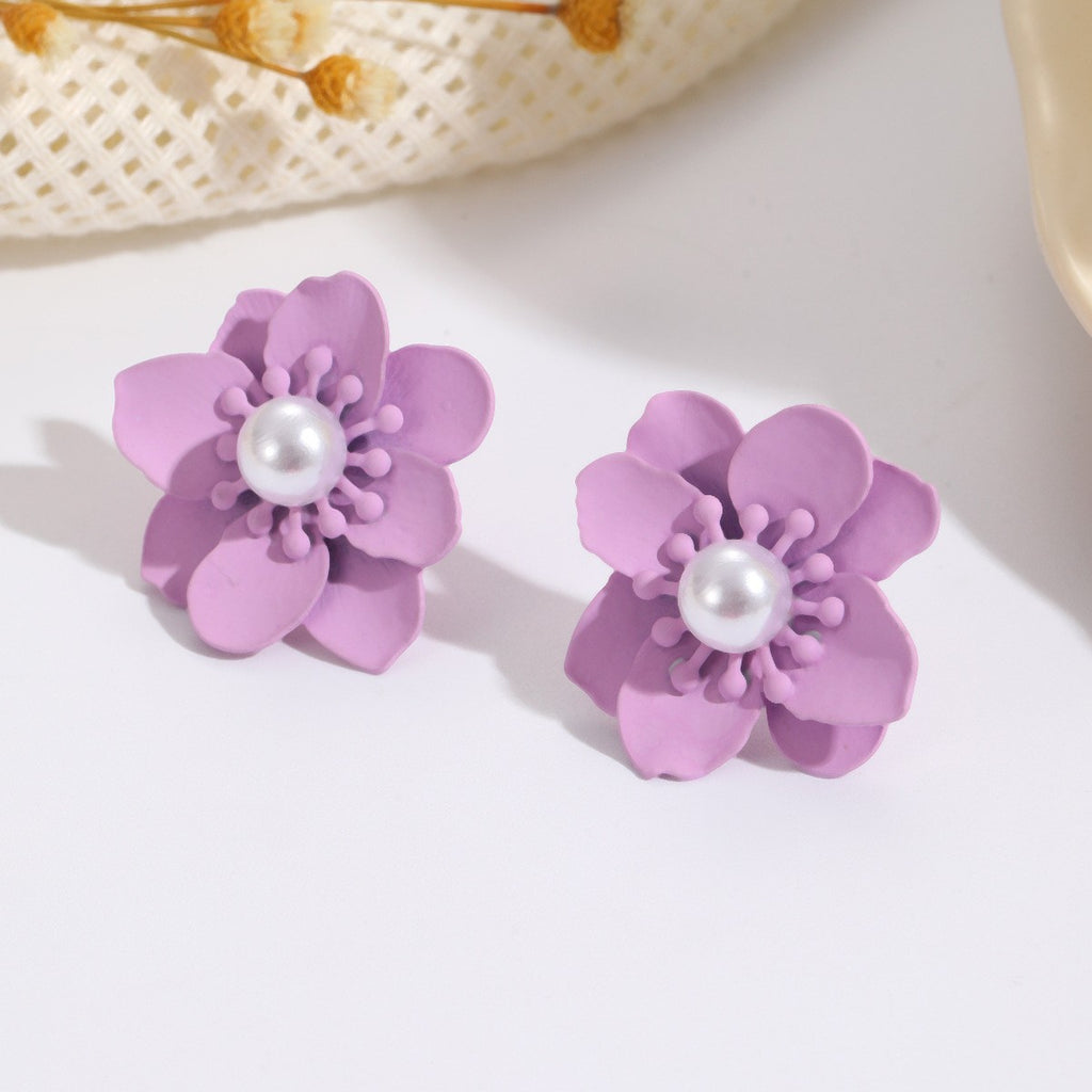 Damen Ohrringe mit kunstvollem Blumenmotiv und Perlenakzent Shop Nory