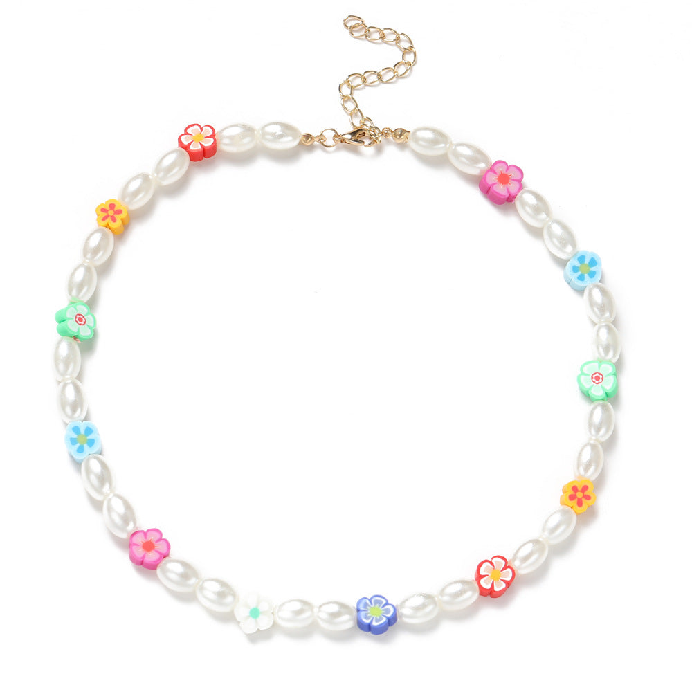 Damen Halskette mit bunten Blumenelementen und eleganten Perlen Shop Nory