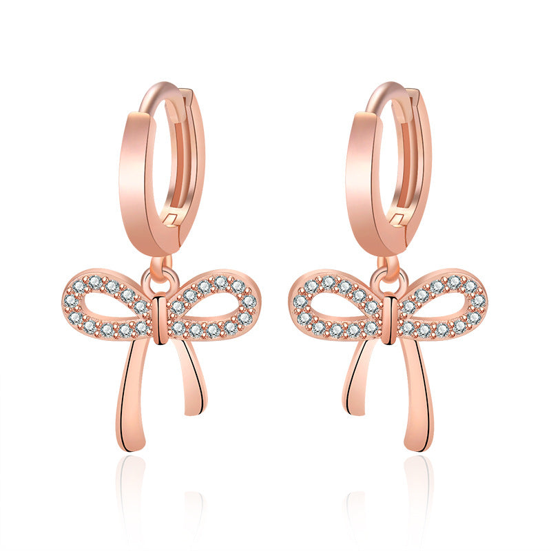Damen Ohrstecker mit funkelndem Schleifen-Design und eleganten Zirkonia-Details Shop Nory