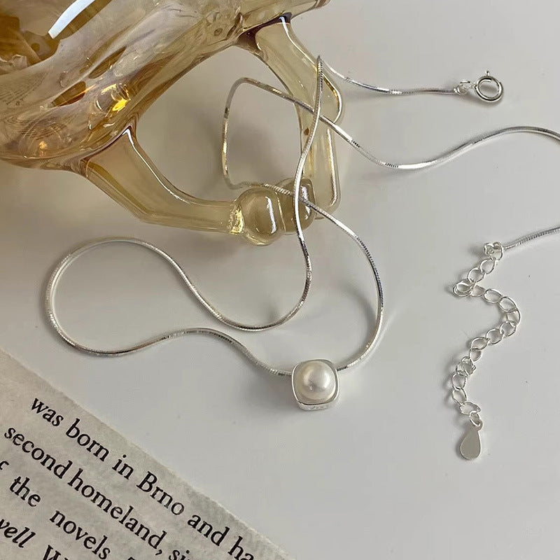 Damen Halskette mit zeitlosem Perlenanhänger und elegantem Silberminimalismus Shop Nory