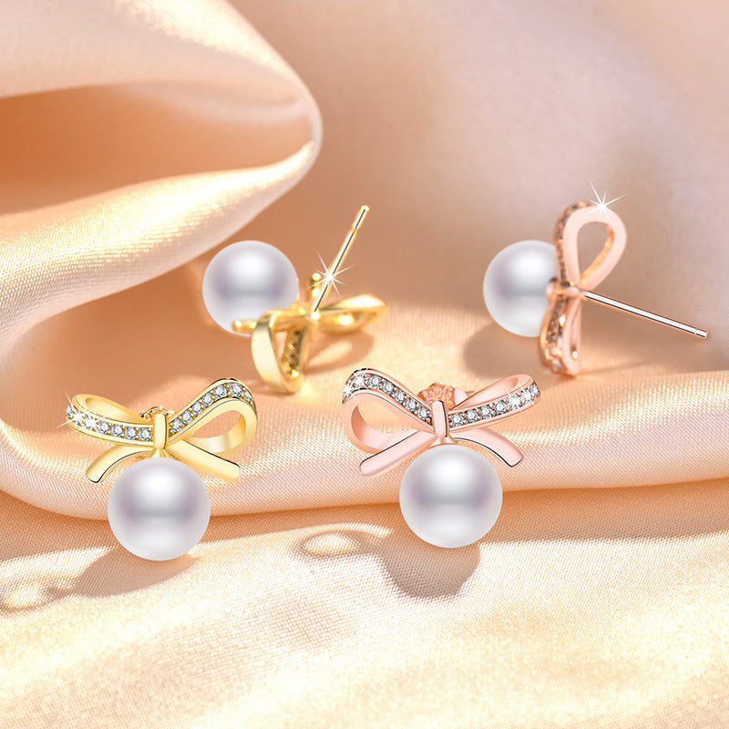 Damen Ohrringe mit Perlendesign und funkelnden Zirkonia Shop Nory