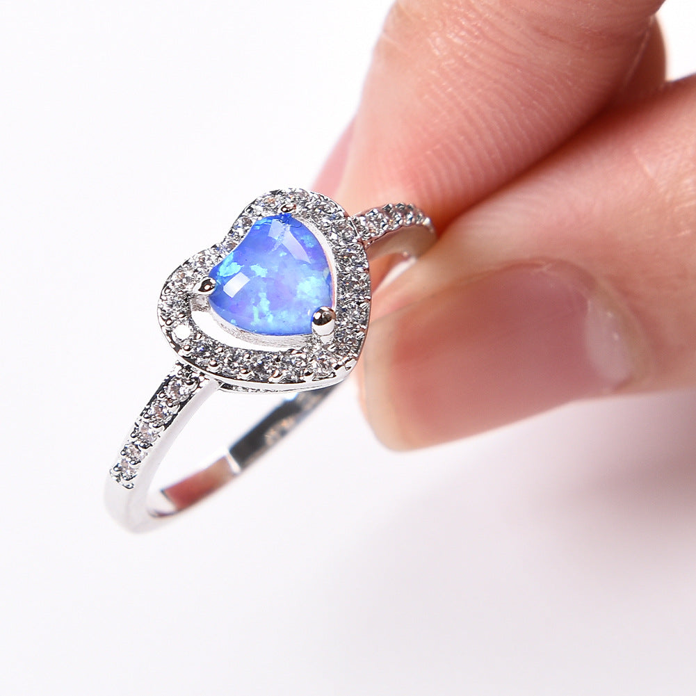 Damen Ring mit herzförmigem Opal und funkelnden Zirkonia-Verzierungen Shop Nory