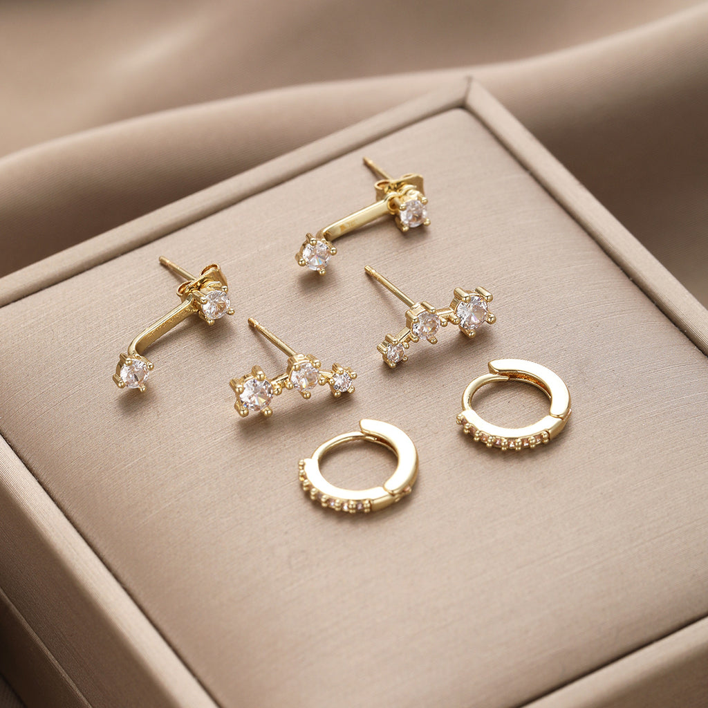 Damen Ohrstecker-Set mit eleganten Spiralen und funkelnden Akzenten Shop Nory