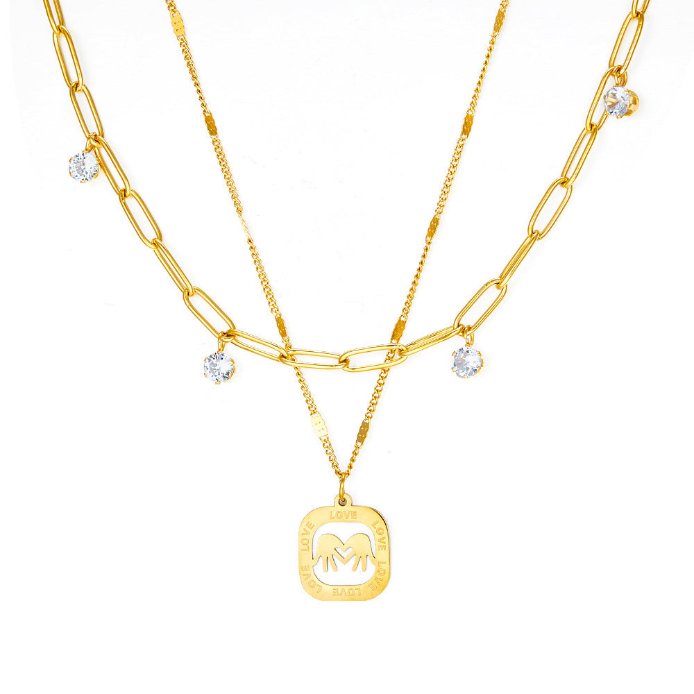 Damen Halskette mit goldplattiertem Anhänger und funkelnden Kristallen Shop Nory
