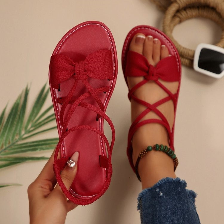 Damen Zarte Römersandalen mit Schleifen-Detail und verstellbaren Schnürriemen Shop Nory