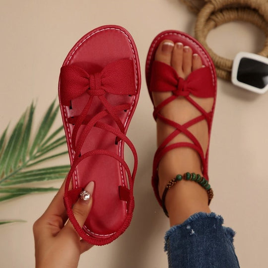 Damen Zarte Römersandalen mit Schleifen-Detail und verstellbaren Schnürriemen Shop Nory