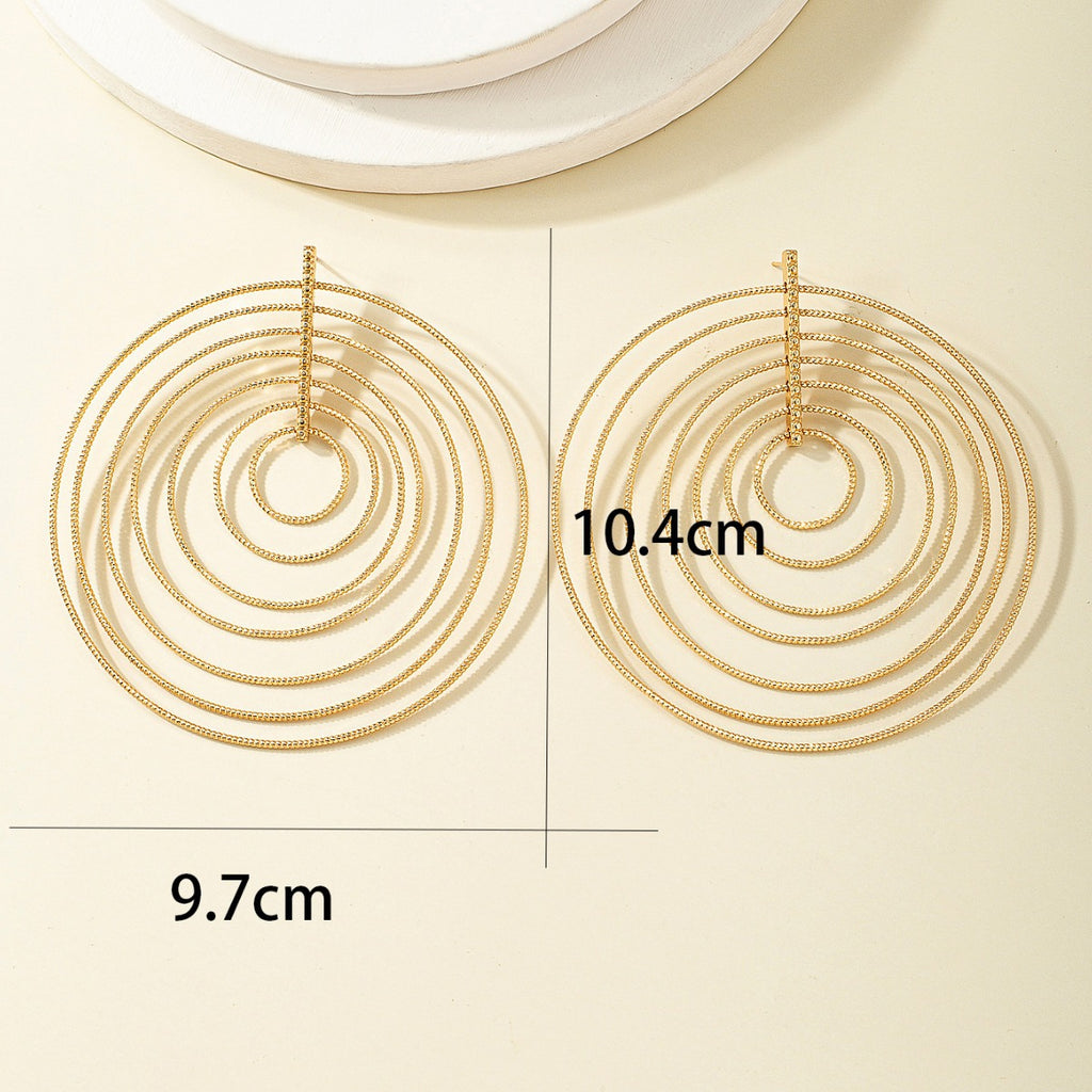 Damen Ohrringe mit geschichteten, kreisförmigen Designelementen Shop Nory