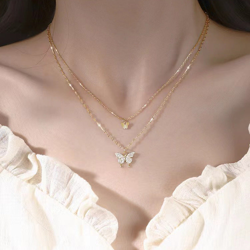 Damen Halskette mit filigranem Schmetterlings-Design und funkelnden Zirkonia Shop Nory