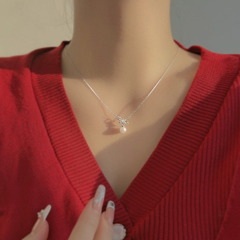 Damen Halskette mit eleganter Schleifen- und Perlenverzierung Shop Nory