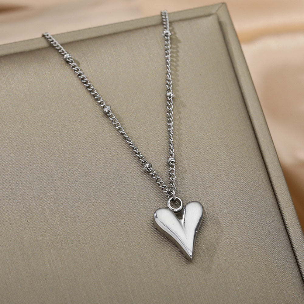 Damen Halskette mit herzförmigem Anhänger aus hochwertigem Edelstahl Shop Nory