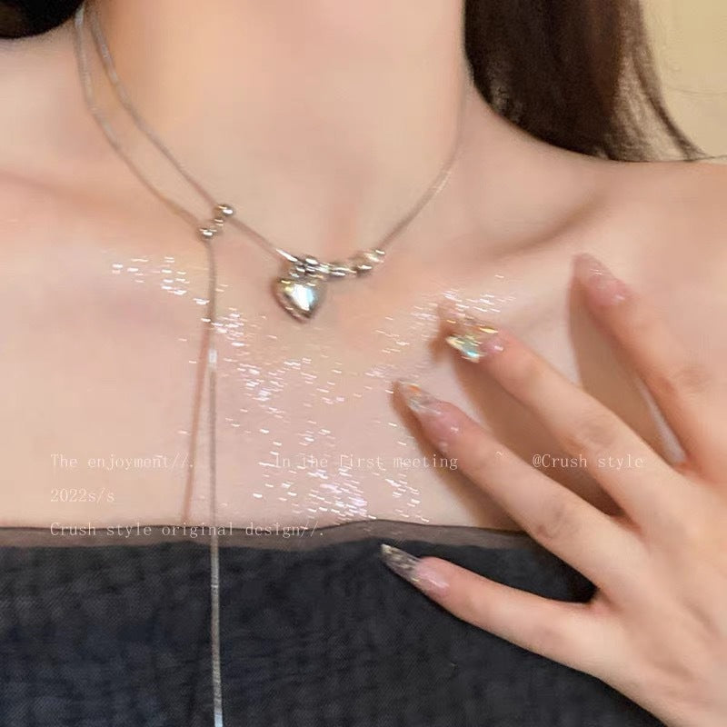 Damen Halskette mit glänzendem Herzanhänger und edlen Kristallelementen Shop Nory