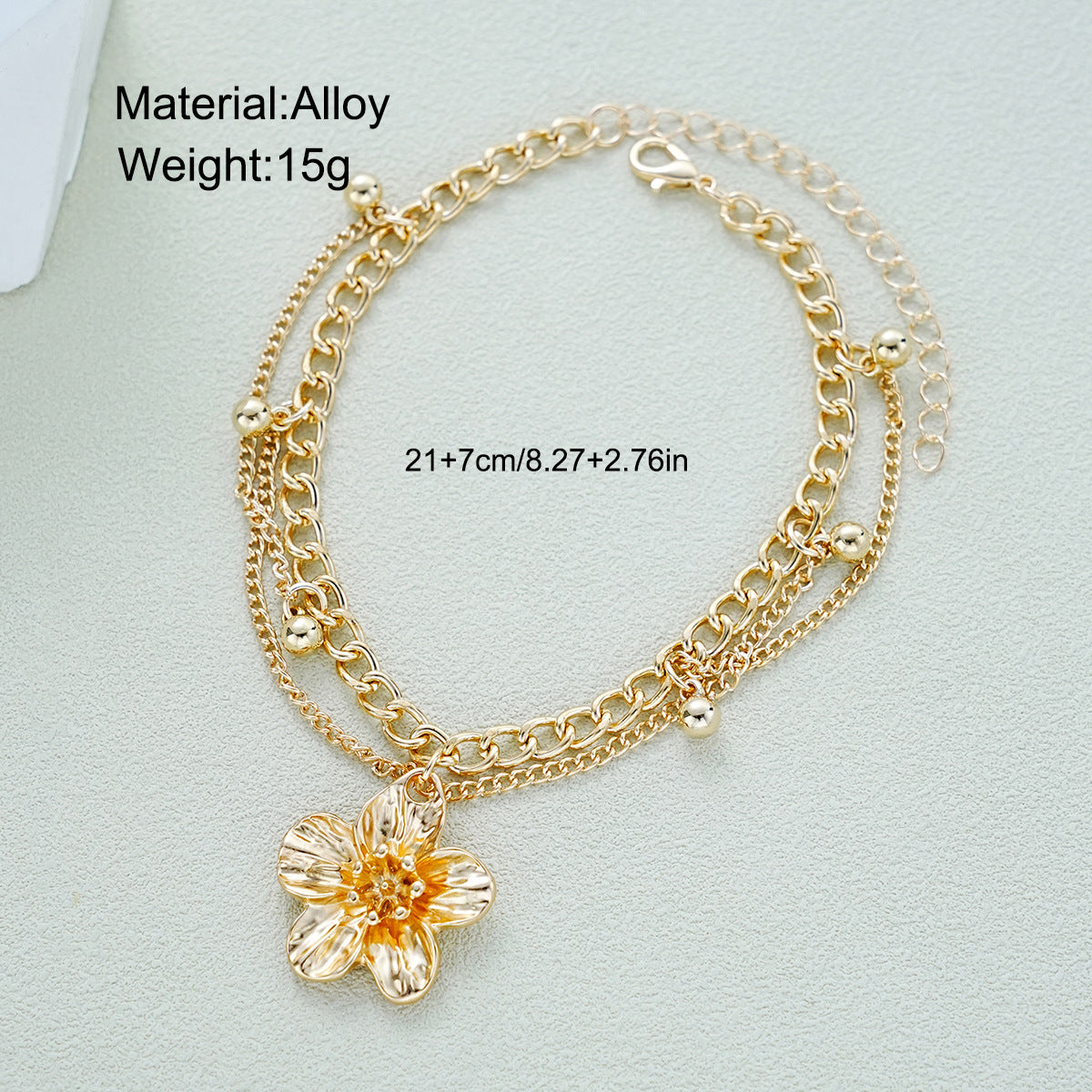 Damen Fußkettchen mit kunstvollem Blütenanhänger und eleganten Kettendetails Shop Nory