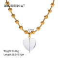 Damen Halskette mit transparentem Herzanhänger und goldene Kugel-Details Shop Nory