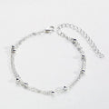 Damenarmband mit modischem Doppelketten-Design und eleganten Metallakzenten Shop Nory