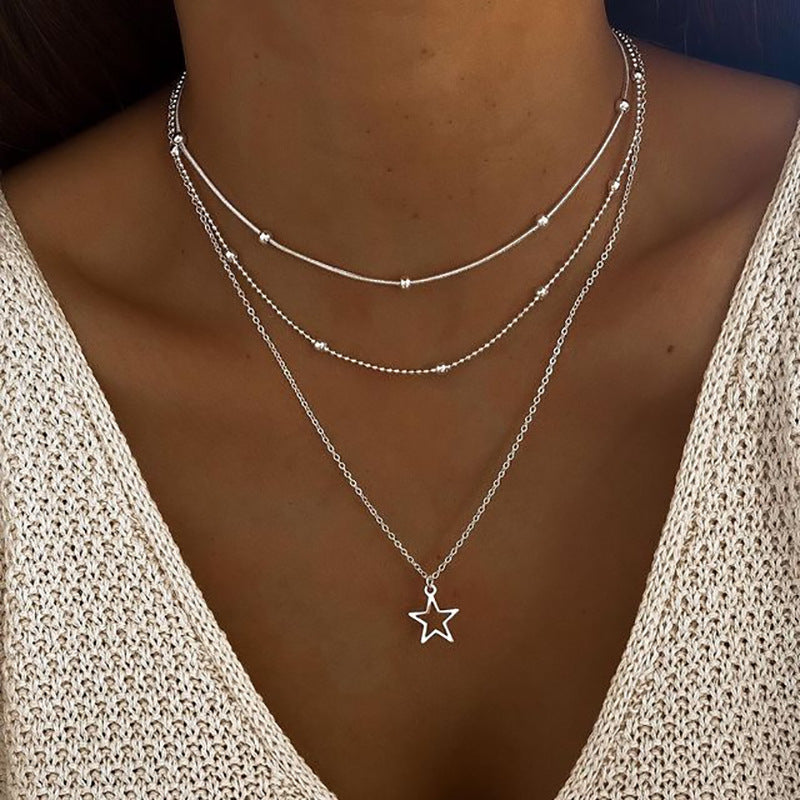 Damen mehrlagige Halskette mit Sternanhänger und eleganten Perlenakzenten Shop Nory