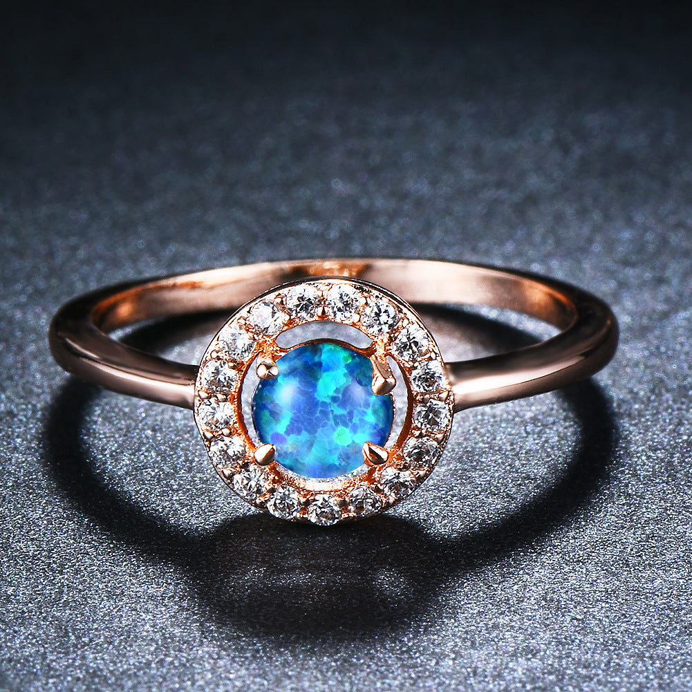 Damen Ring mit schimmerndem Opal und funkelnden Zirkoniastein-Verzierungen Shop Nory