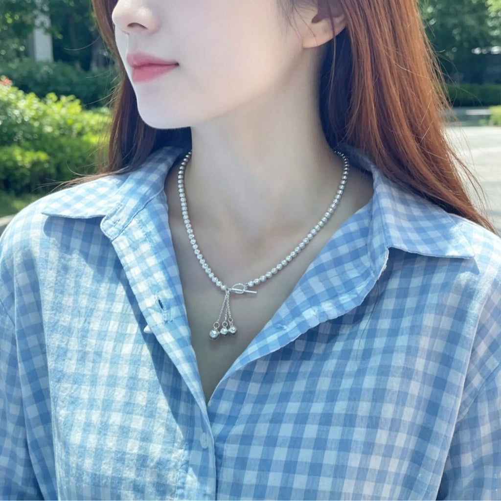 Damen Halskette mit eleganten Perlen und schimmerndem Anhänger Shop Nory