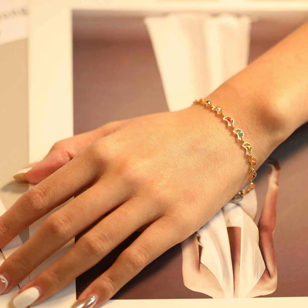 Damen Armband aus Edelstahl mit bunten Herz-Elementen und feiner Goldbeschichtung Shop Nory