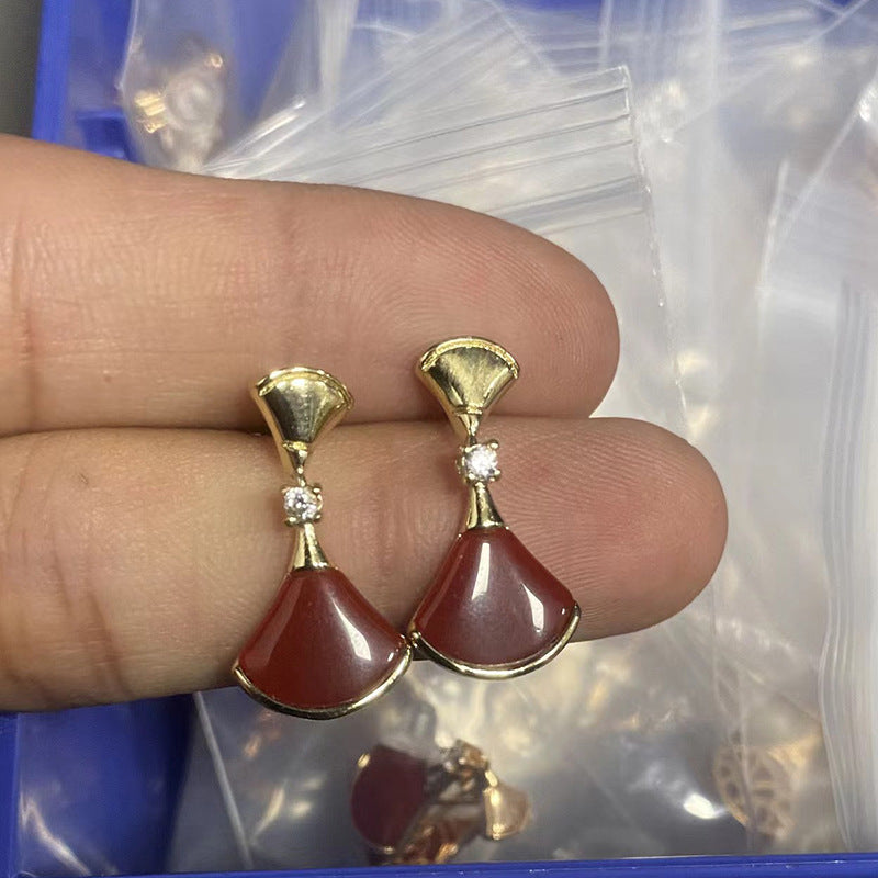 Damen Ohrringe mit kunstvollem Perlmutt-Design und funkelnden Zirkonia Shop Nory