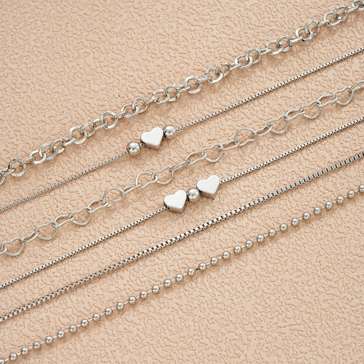 Damen Armband-Set mit filigranen Herzmotiv und funkelnden Akzenten Shop Nory