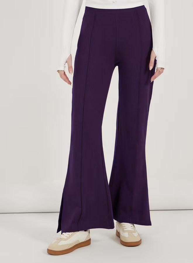 Damen Flair-Hose mit hoher Taille, durchgehender Bügelfalte und seitlichem Saumschlitz Shop Nory