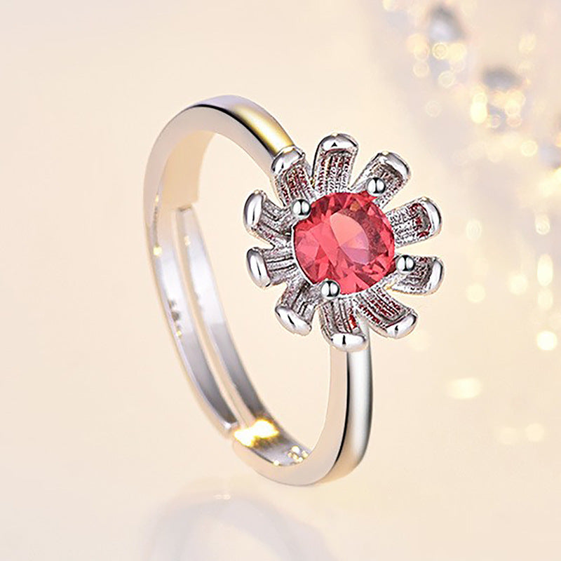 Damenring mit funkelndem rotem Edelstein und floralem Design Shop Nory