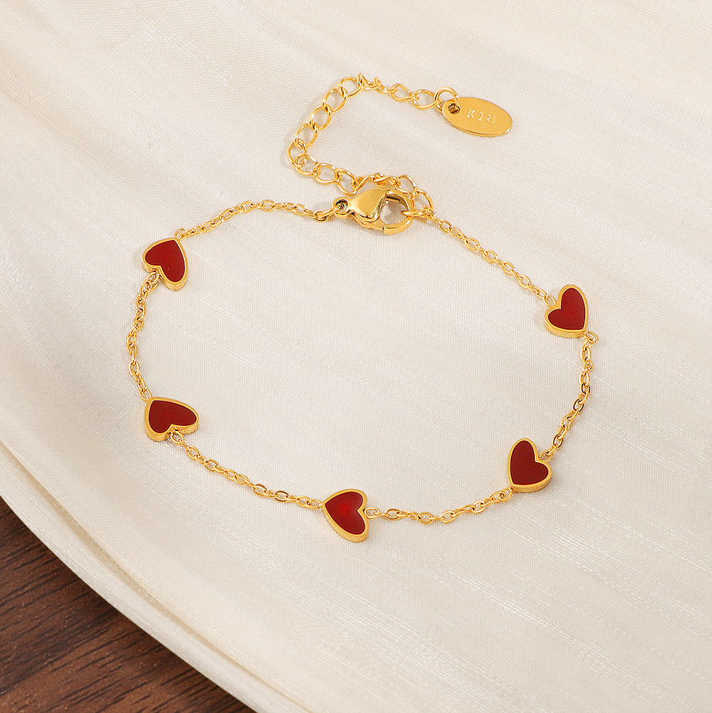 Damen Armband mit herzförmigen Anhängern Shop Nory
